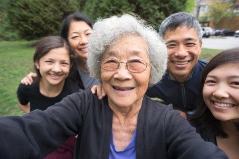 Asian family smiling good oral health